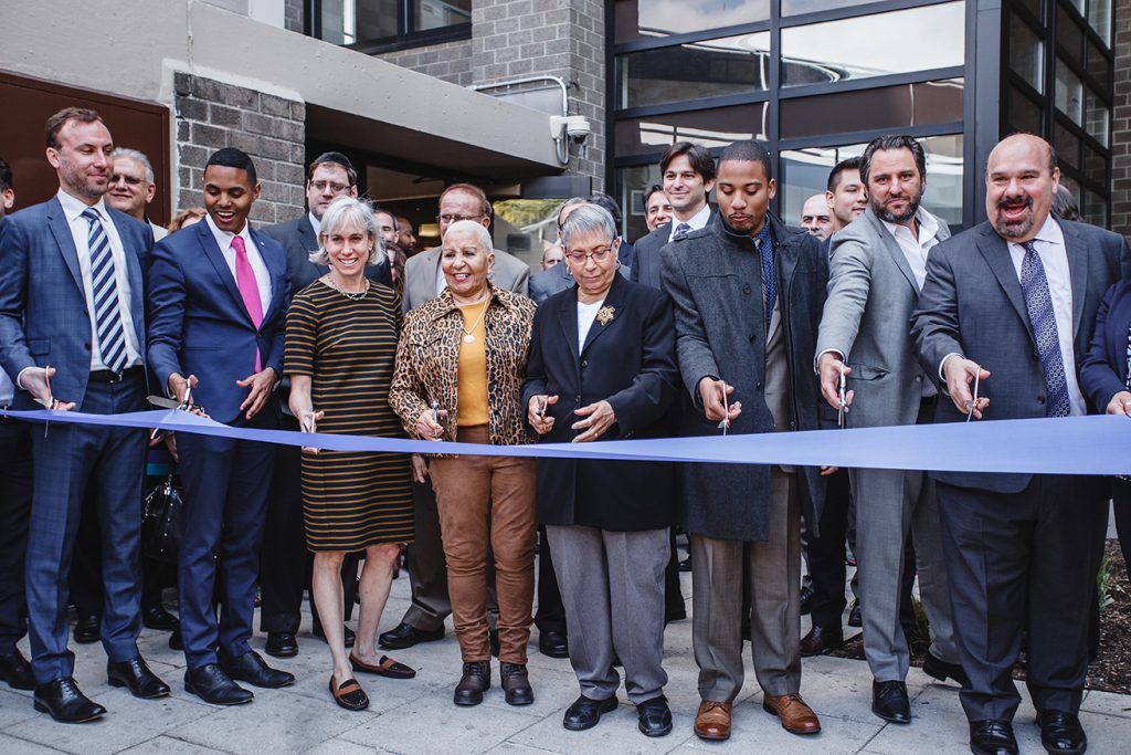 Ribbon-cutting ceremony photographed at a New York opening